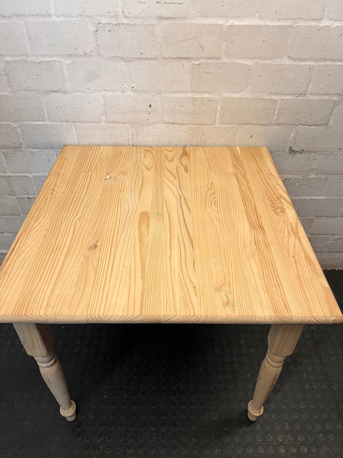 Square Pine Dining Table with Turned Legs — Feet Not Properly Installed – back view