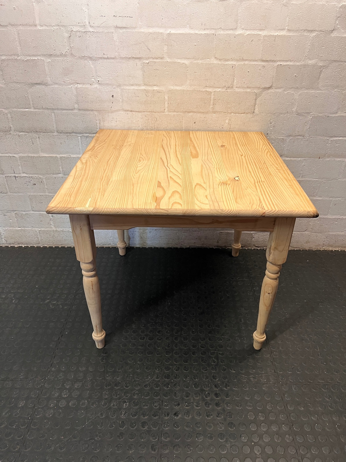 Square Pine Dining Table with Turned Legs — Feet Not Properly Installed – main front view