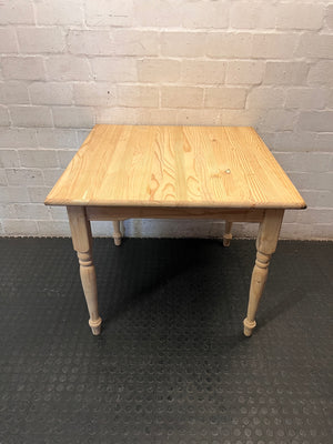 Square Pine Dining Table with Turned Legs — Feet Not Properly Installed – main front view