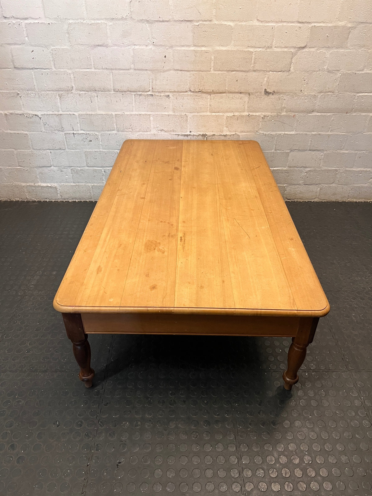 Large Honey-Toned Wooden Coffee Table with Turned Legs – back view