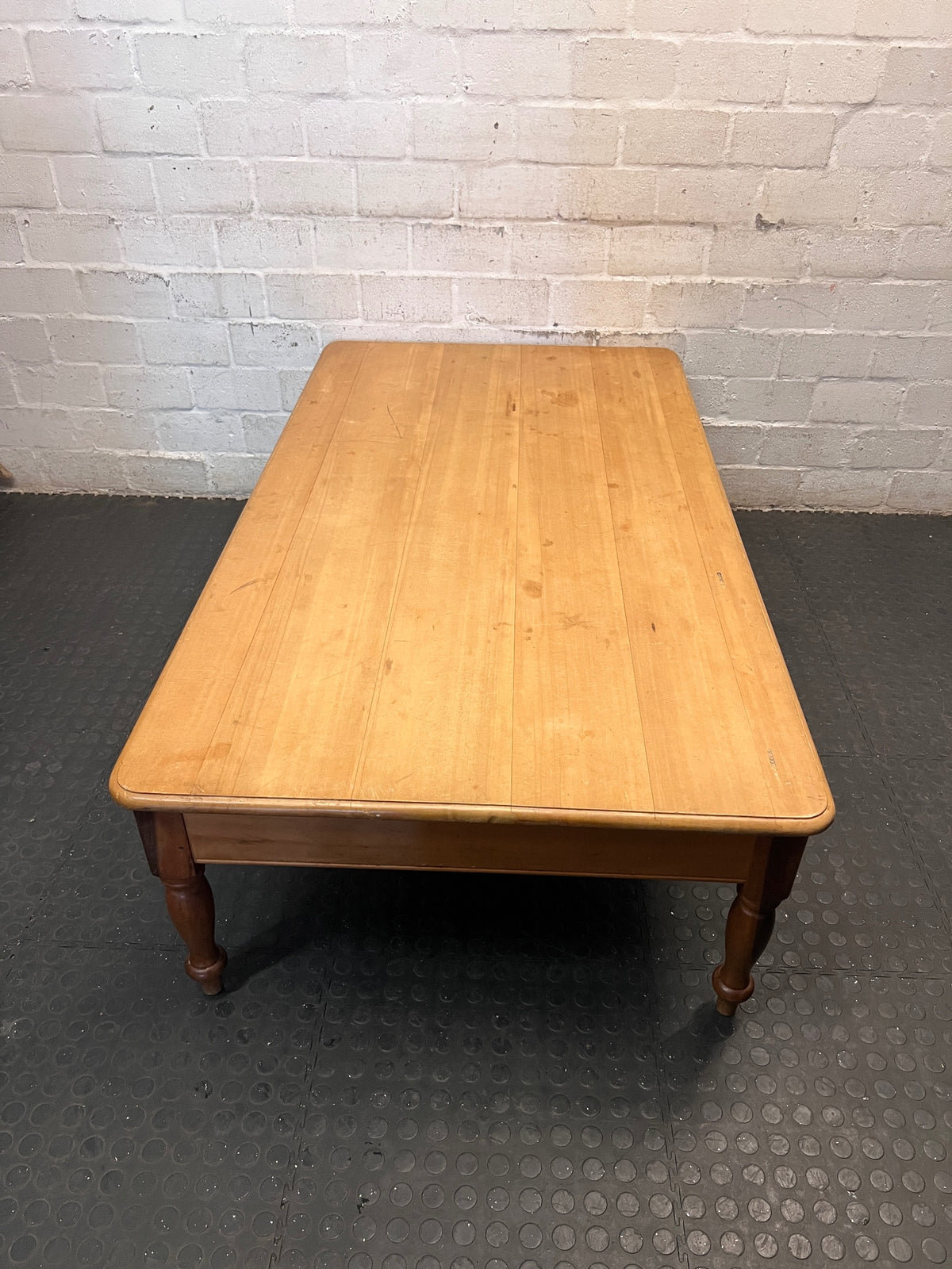 Large Honey-Toned Wooden Coffee Table with Turned Legs – side view