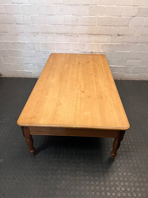 Large Honey-Toned Wooden Coffee Table with Turned Legs – side view