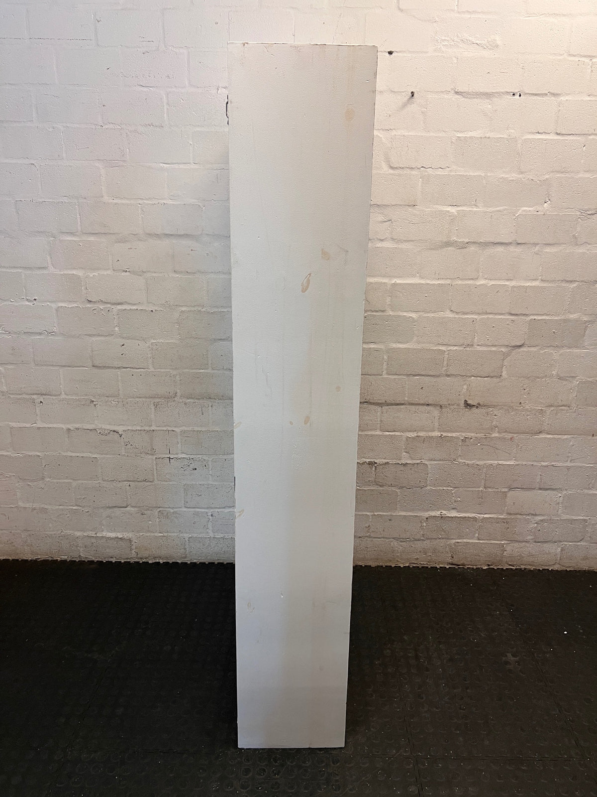 Tall White Asymmetrical Bookshelf with Cubby Shelves – back view
