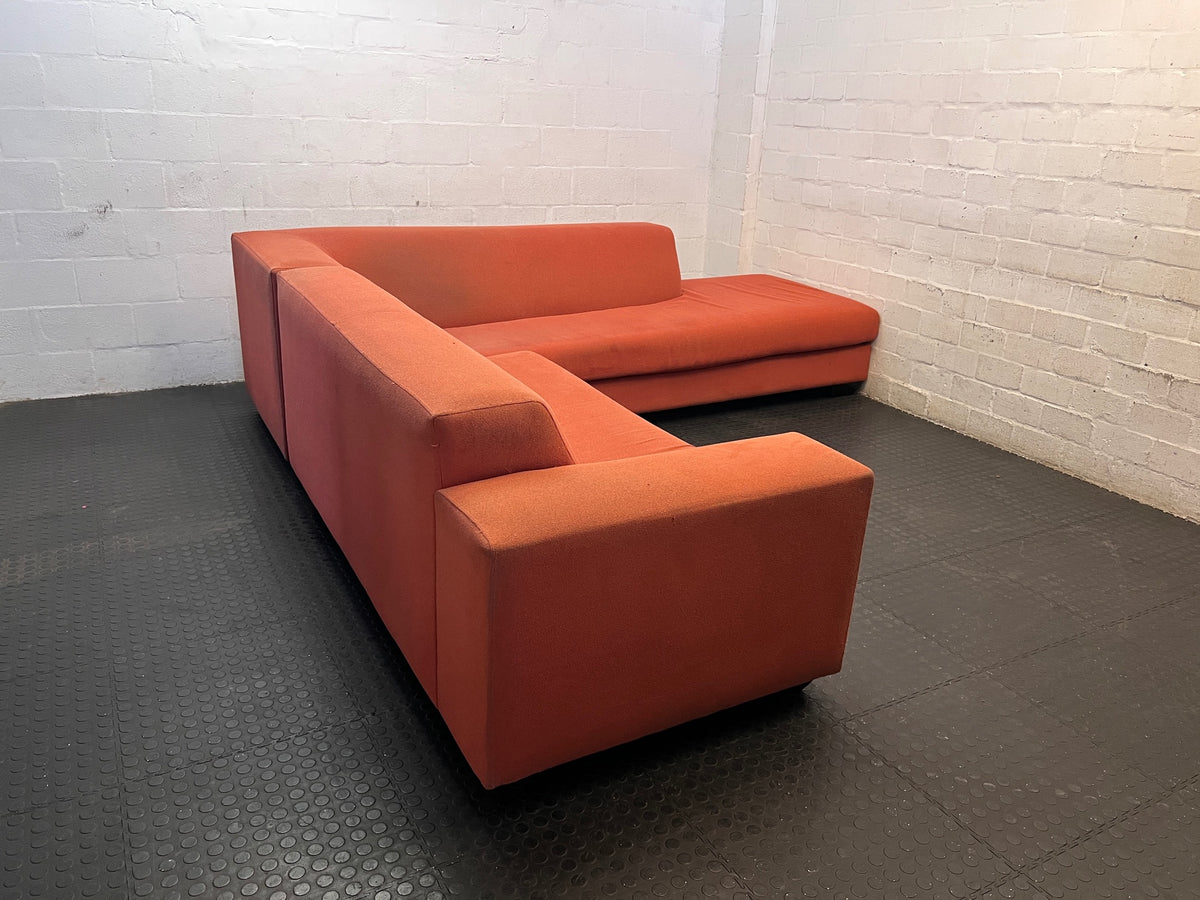 Large Coral Fabric L-Shape Sectional Couch — Visible Wear and Marks – back view