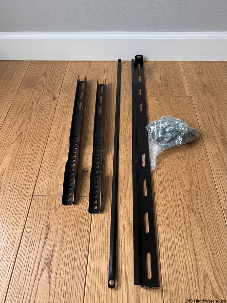 Black Metal TV Wall Mount Bracket with Hardware – styled product image