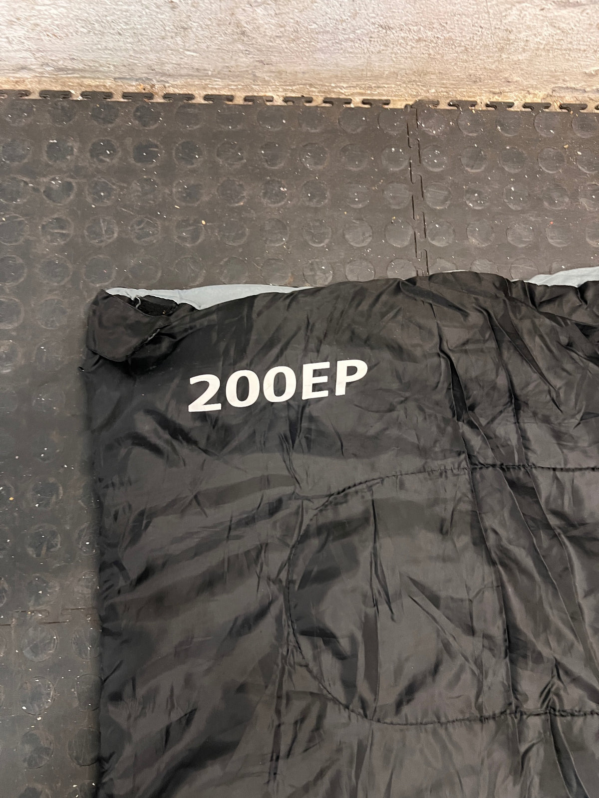 Black Rectangular 200EP Sleeping Bag — Fair Condition With Signs of Wear – condition detail