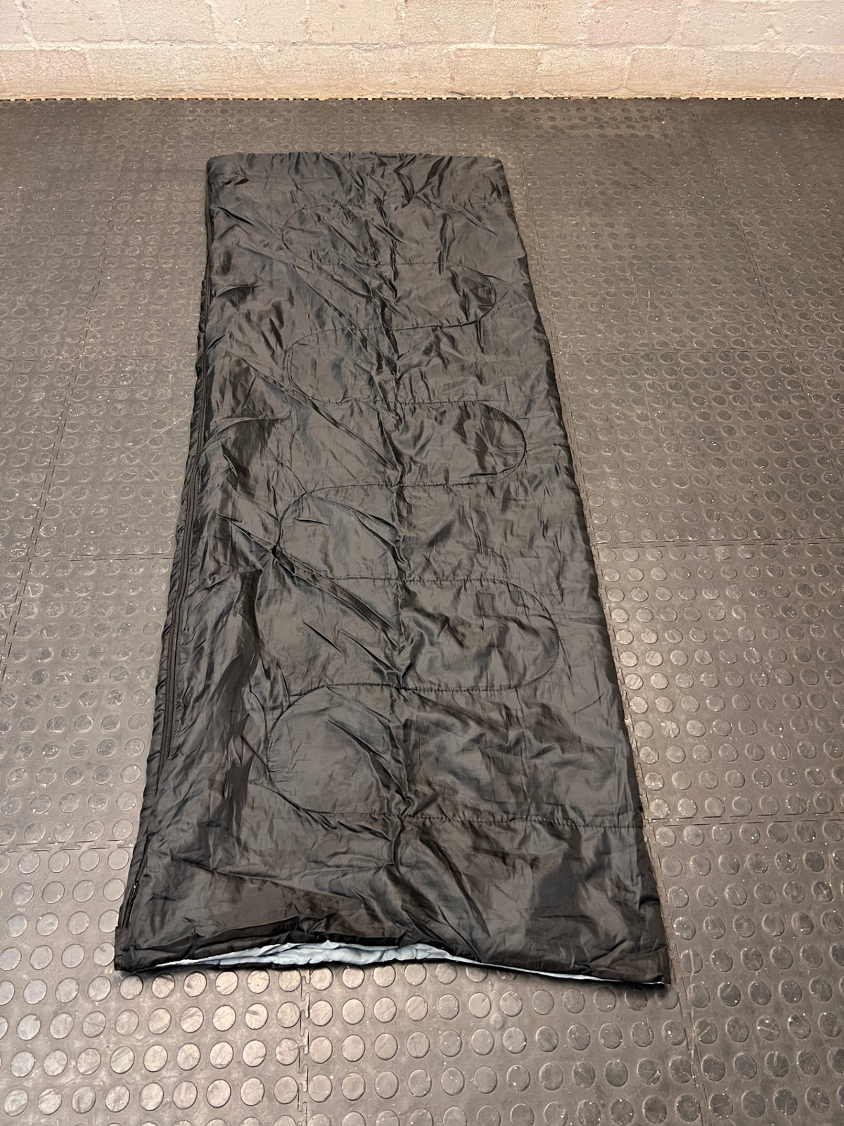 Black Rectangular 200EP Sleeping Bag — Fair Condition With Signs of Wear – side view