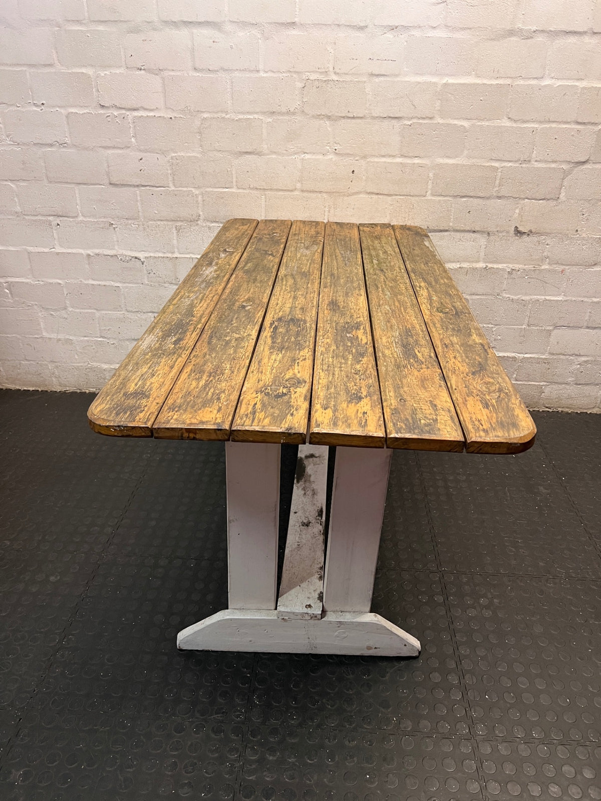 Rustic Wooden Trestle Garden Table — Weather Soiled Wood Surface – back view