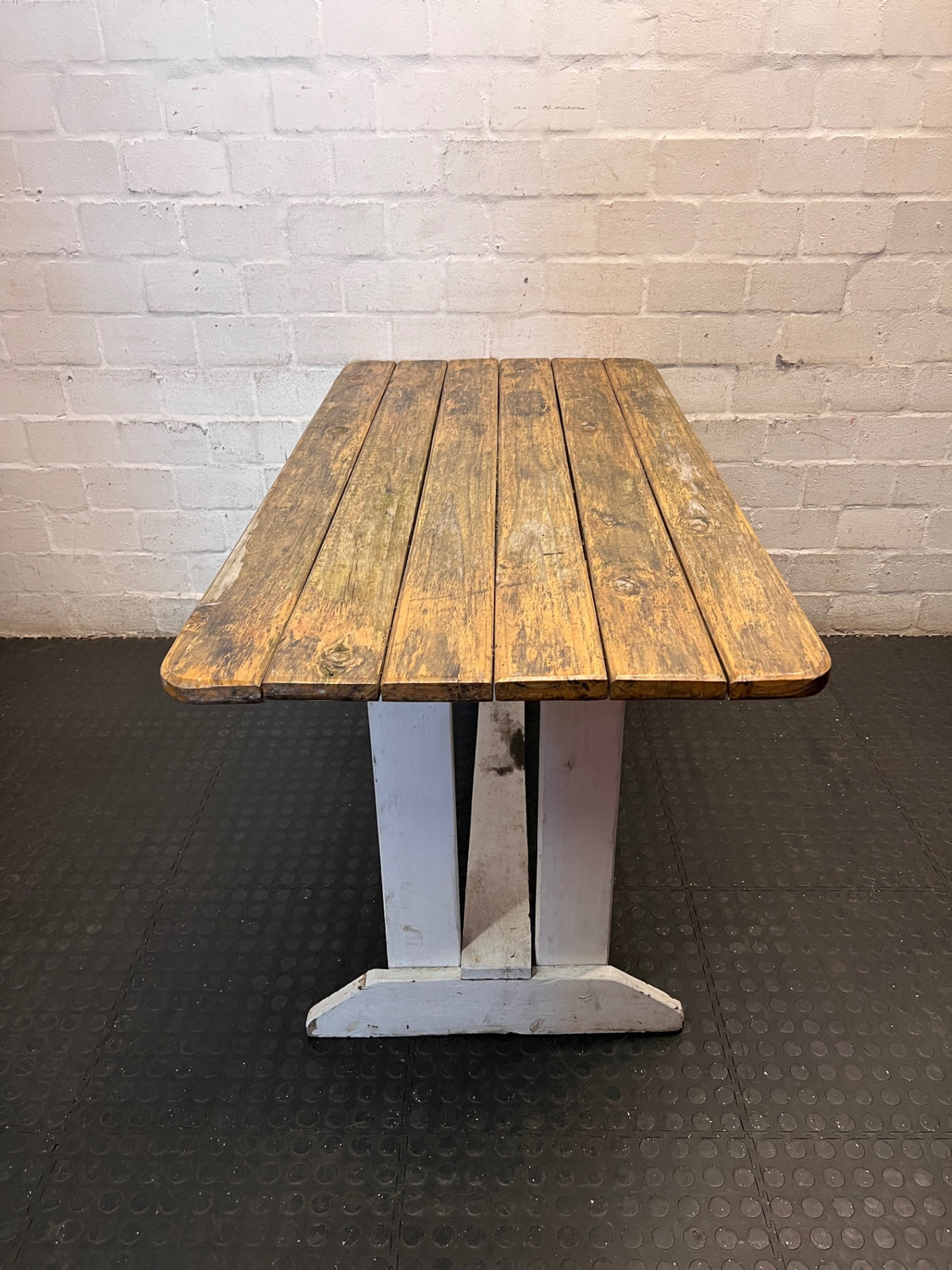 Rustic Wooden Trestle Garden Table — Weather Soiled Wood Surface – side view