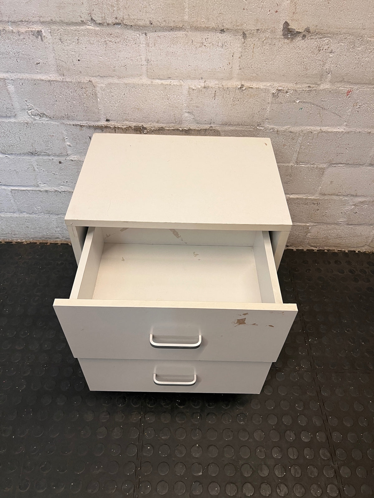 White Two-Drawer Bedside Table with Silver Handles — Scuff Marks on Drawer Front – side view