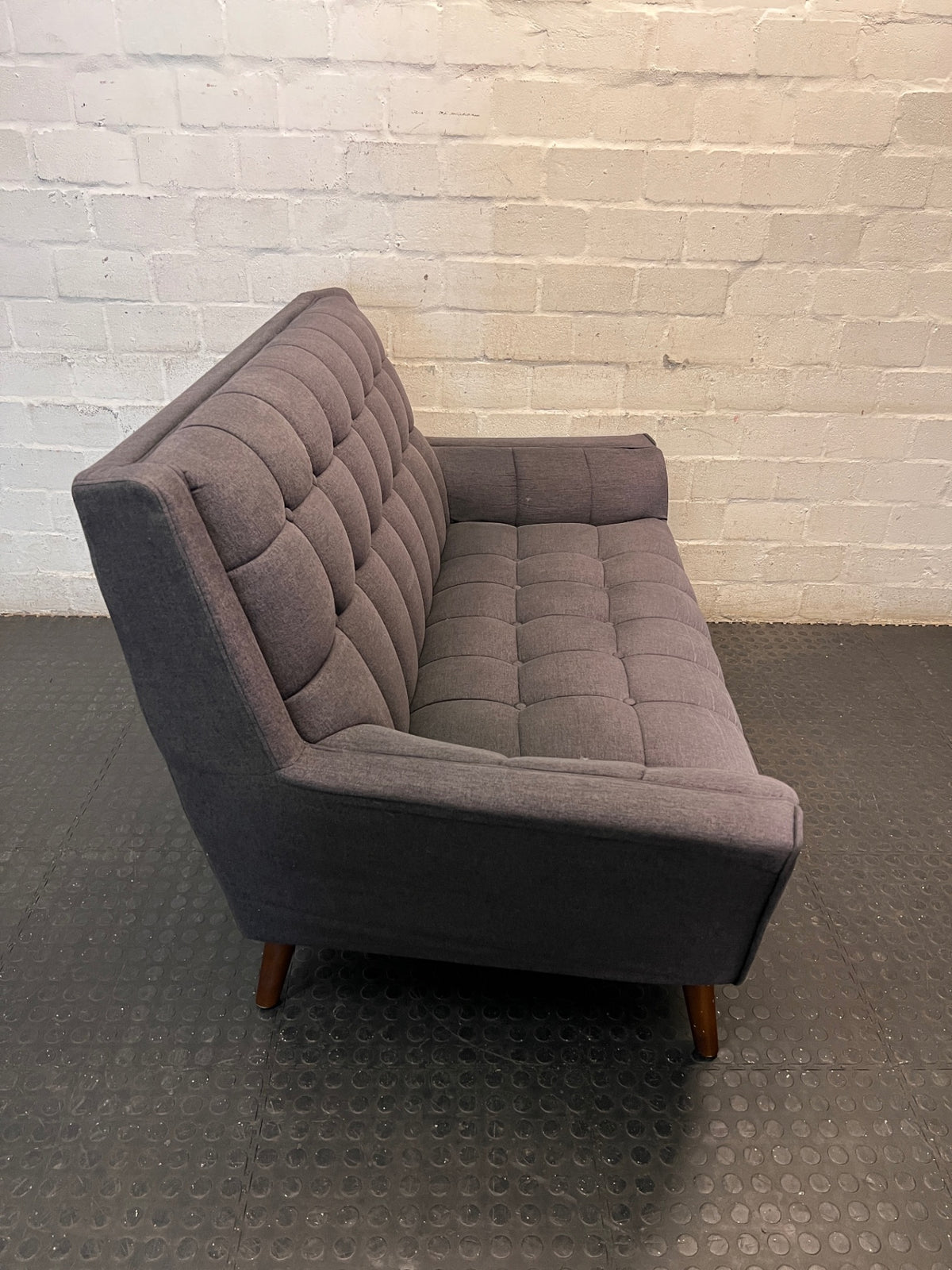 Grey Tufted Fabric 2 Seater Couch with Wooden Legs — Good with Minor Wear and Tear – back view