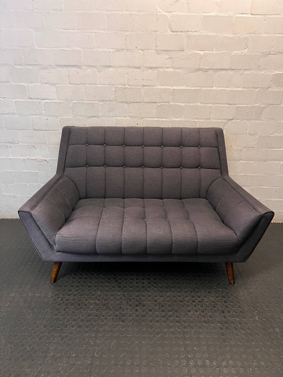 Grey Tufted Fabric 2 Seater Couch with Wooden Legs — Good with Minor Wear and Tear – main front view