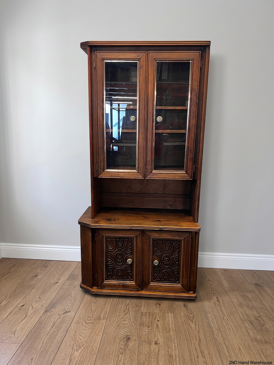 Vintage Wood Display Cabinet with Glass Doors & Carved Detail – styled product image