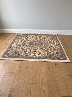 Square Patterned Area Rug with Fringe Border – styled product image
