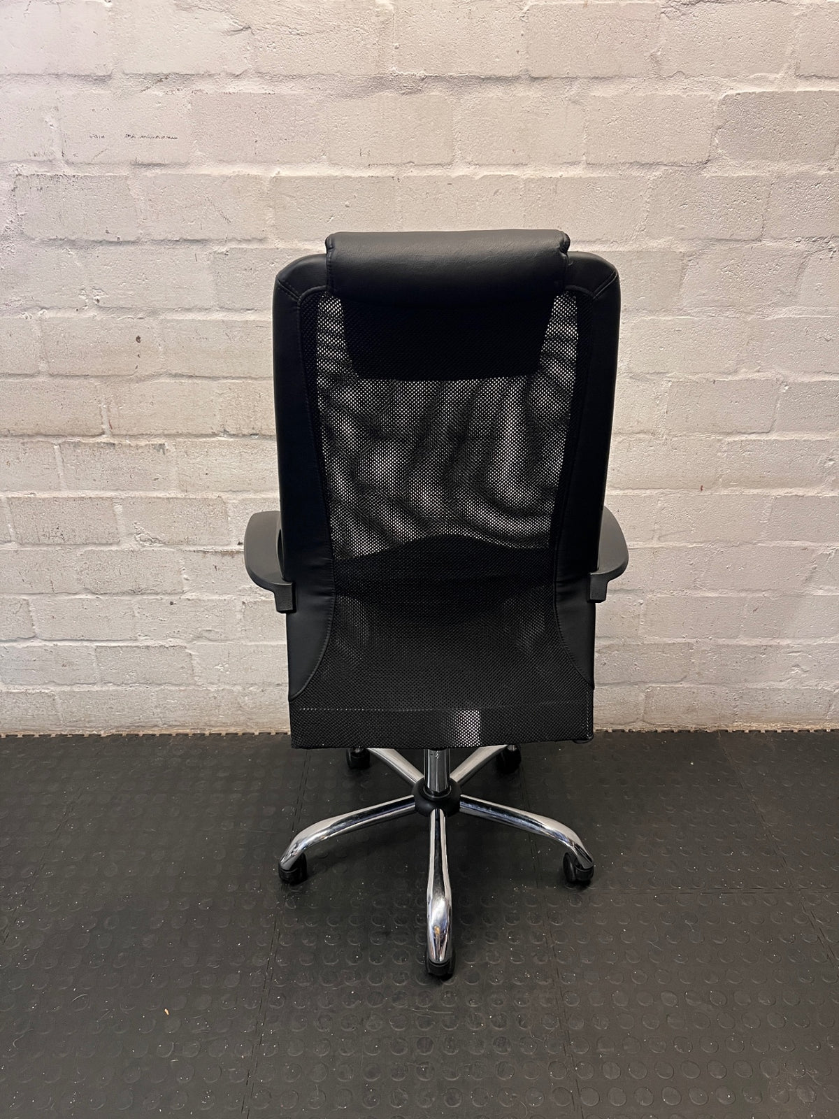 Black High-Back Office Chair with Mesh and Chrome Base — Damaged Upholstery – back view