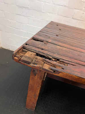Large Dark Varnished Wood Outdoor Table — Broken Leg Join and Structural Damage – back view