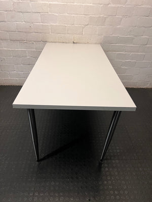 White Rectangular Office Desk with Tapered Metal Legs – back view