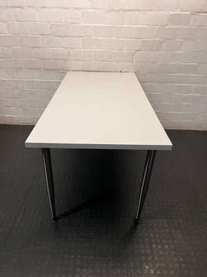 White Rectangular Office Desk with Tapered Metal Legs – side view