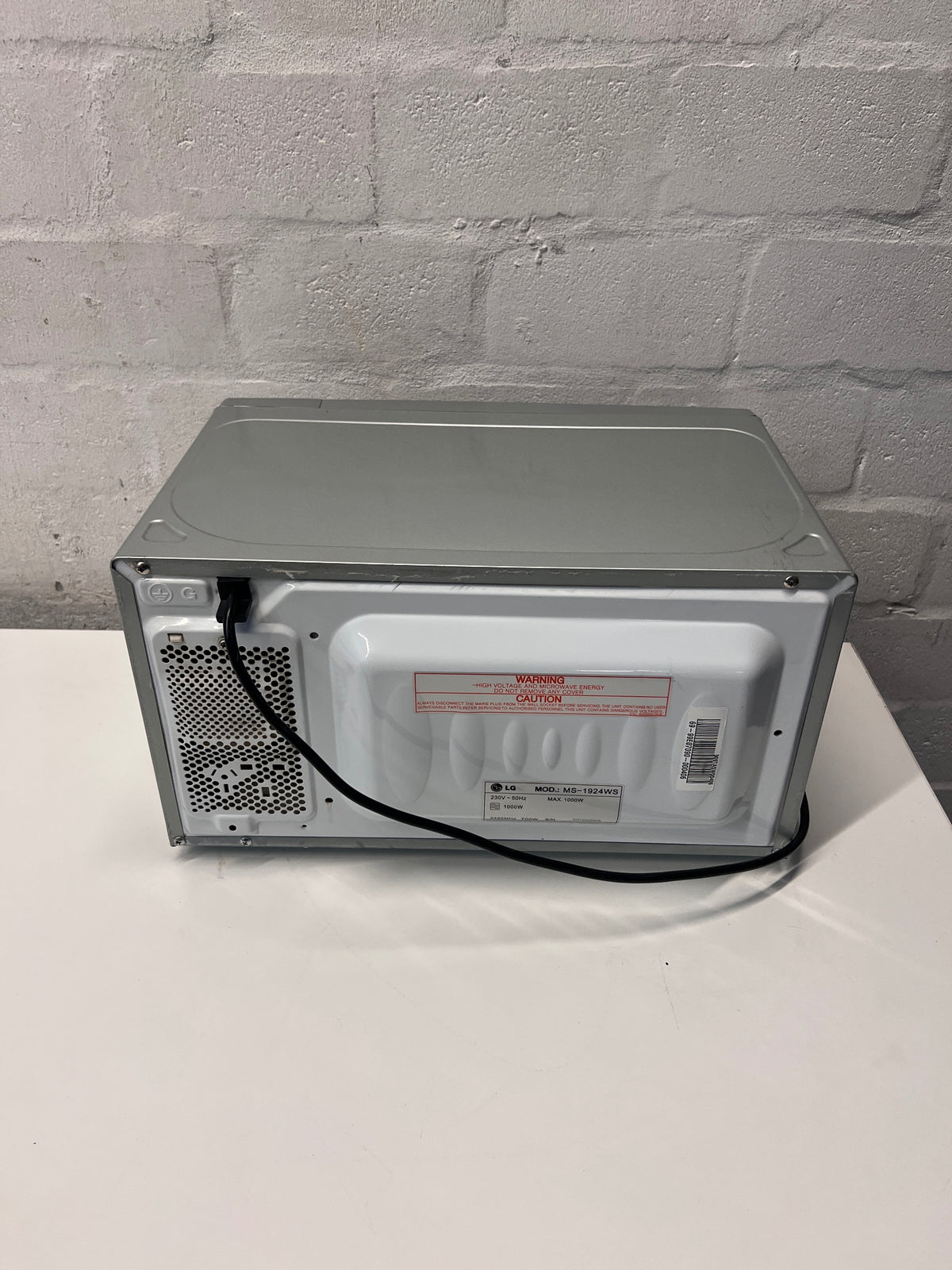 LG Silver Countertop Microwave with Manual Dials — Working but Plate Does Not Rotate – back view