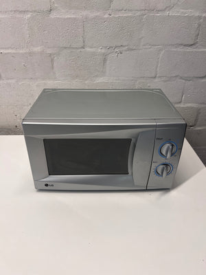 LG Silver Countertop Microwave with Manual Dials — Working but Plate Does Not Rotate – main front view