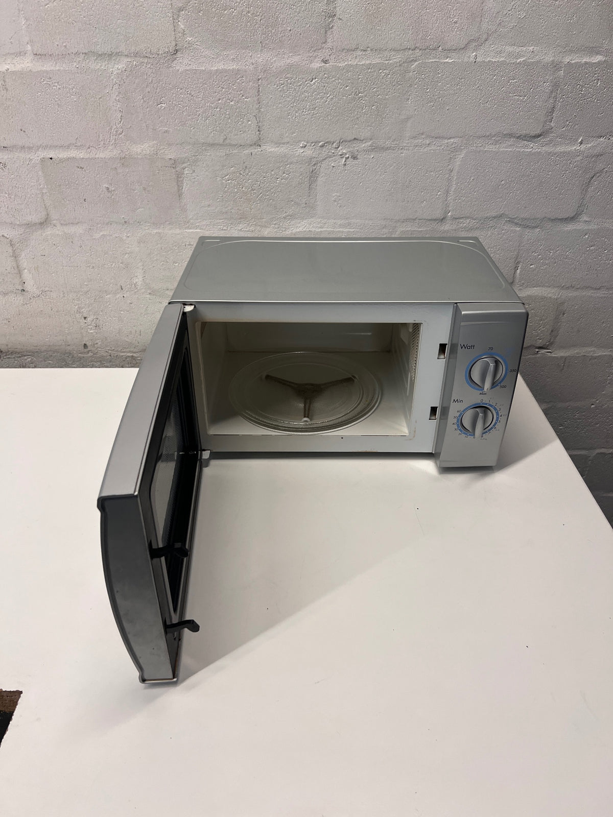 LG Silver Countertop Microwave with Manual Dials — Working but Plate Does Not Rotate – side view