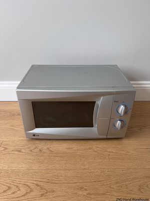 LG Silver Countertop Microwave with Manual Dials — Working but Plate Does Not Rotate – styled product image
