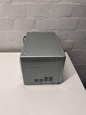 LG Silver Countertop Microwave with Manual Dials — Working but Plate Does Not Rotate – top view