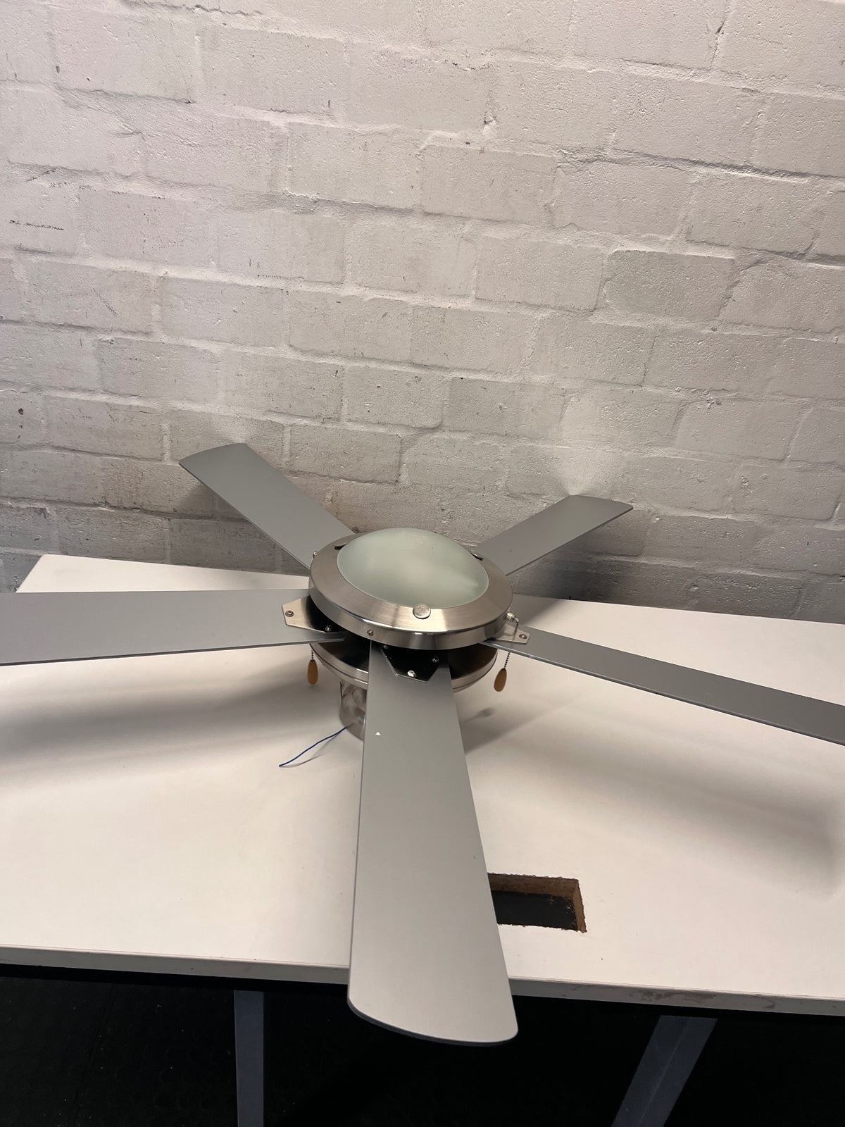 Silver 4-Blade Ceiling Fan with Integrated Light – side view