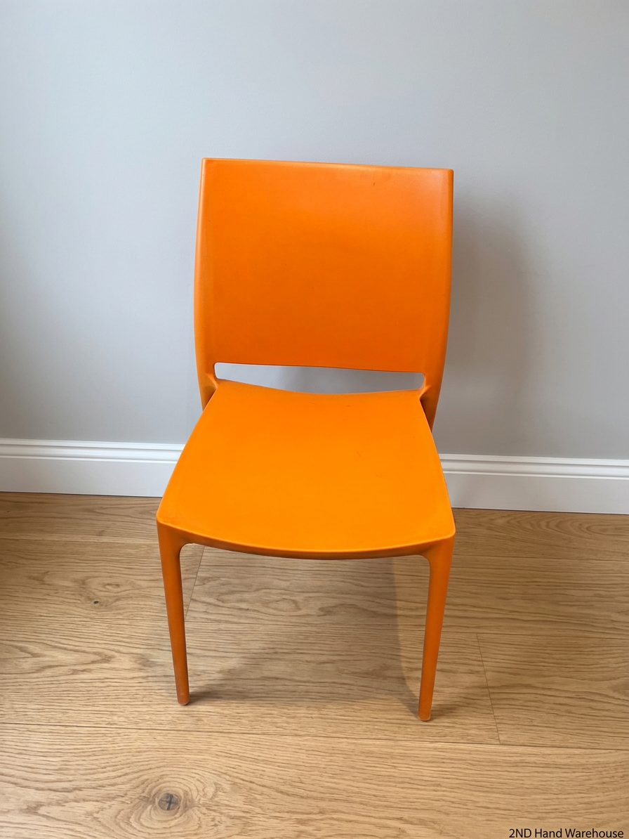 Modern Vibrant Orange Moulded Plastic Chair – styled product image