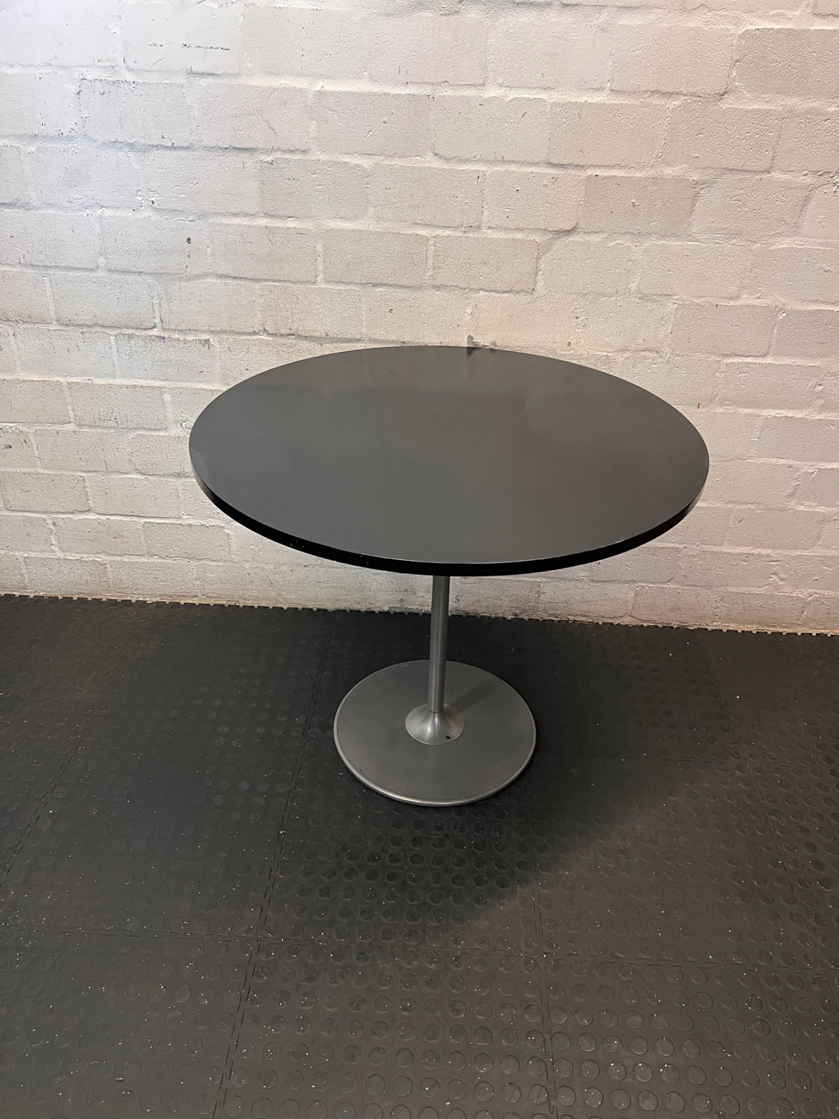 Round Black Table with Metallic Pedestal Base – main front view