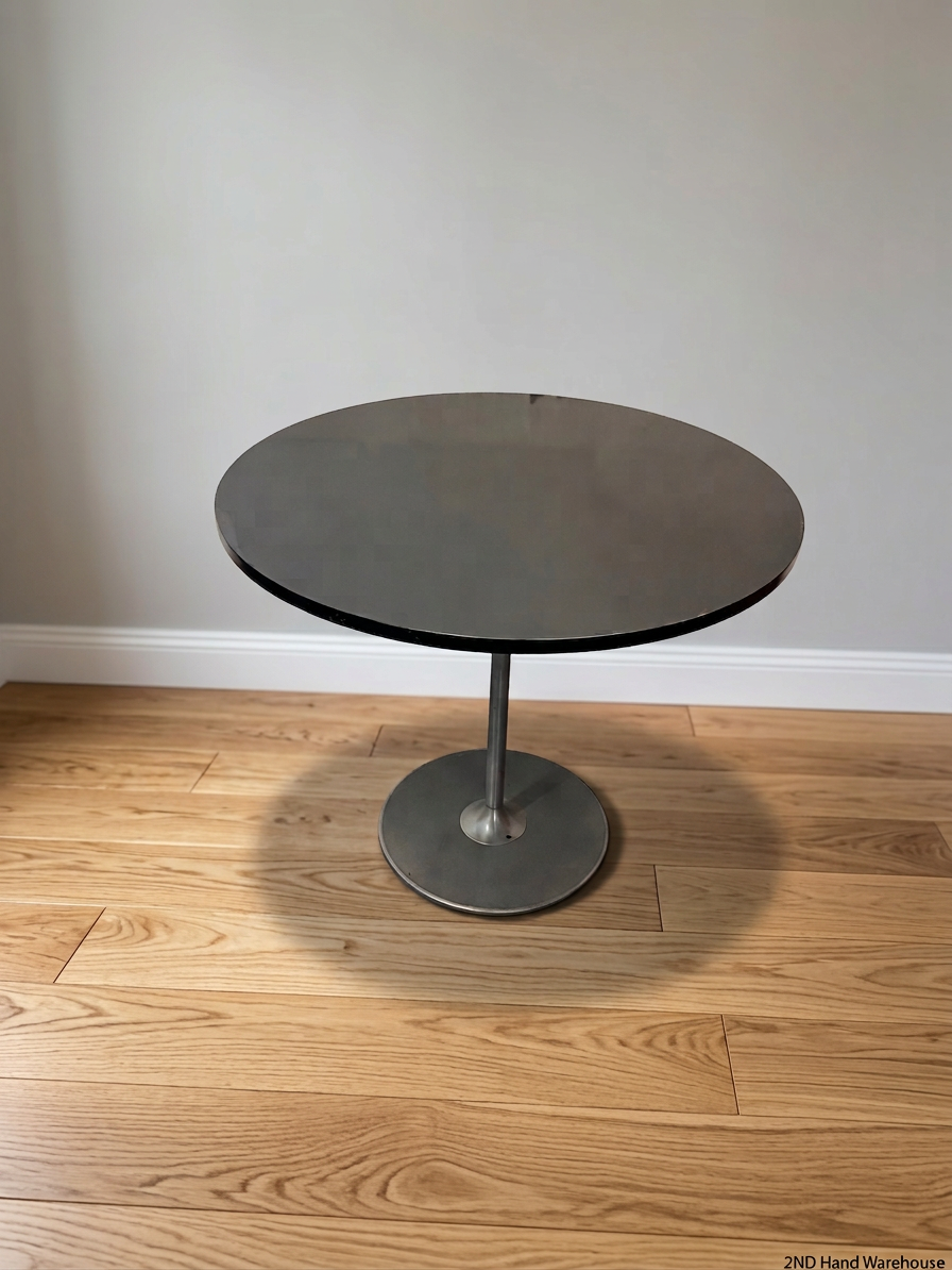 Round Black Table with Metallic Pedestal Base – styled product image
