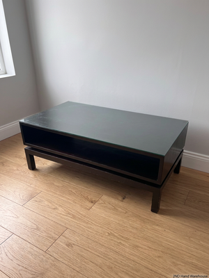 Dark Wood Coffee Table with Glass Top and Storage Shelf – styled product image