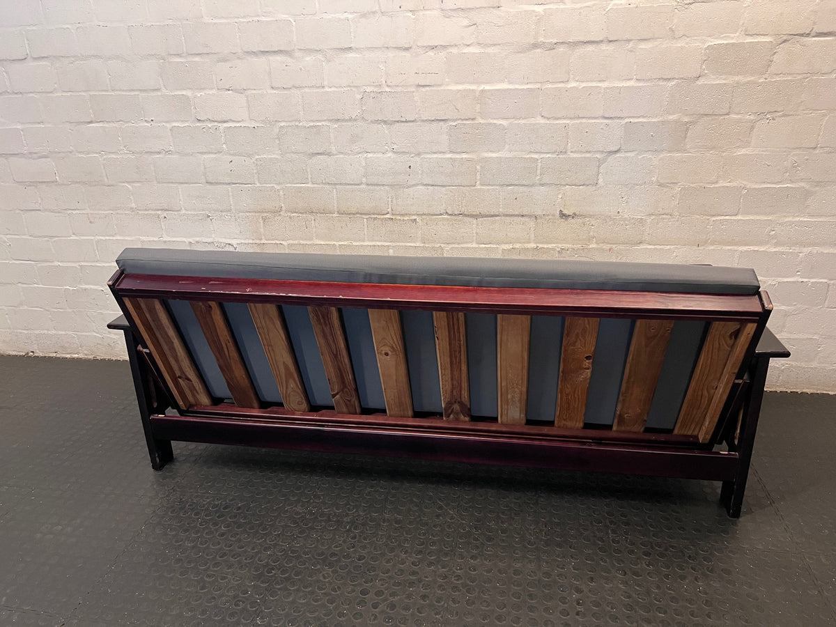 Dark Wood Sleeper Couch with Grey Mattress – back view