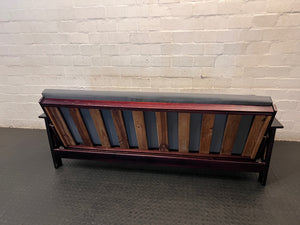 Dark Wood Sleeper Couch with Grey Mattress – back view
