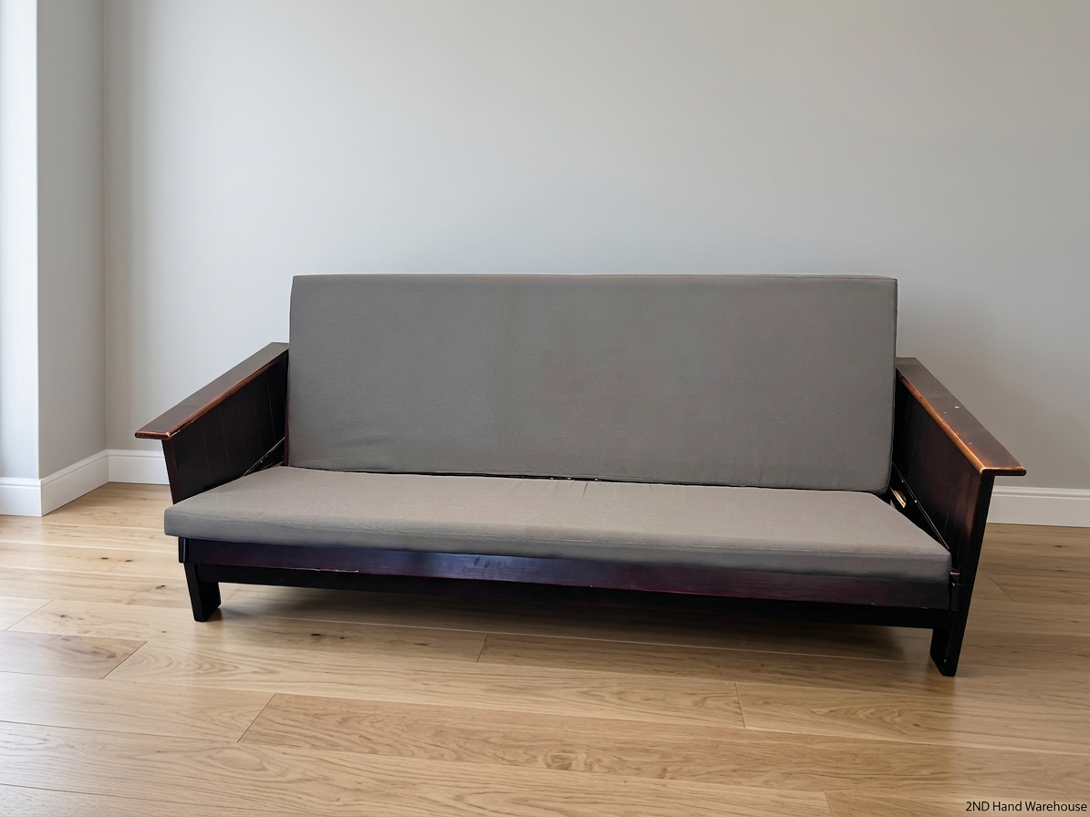 Dark Wood Sleeper Couch with Grey Mattress – styled product image