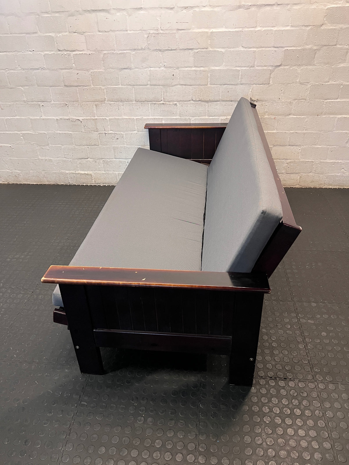 Dark Wood Sleeper Couch with Grey Mattress – top view