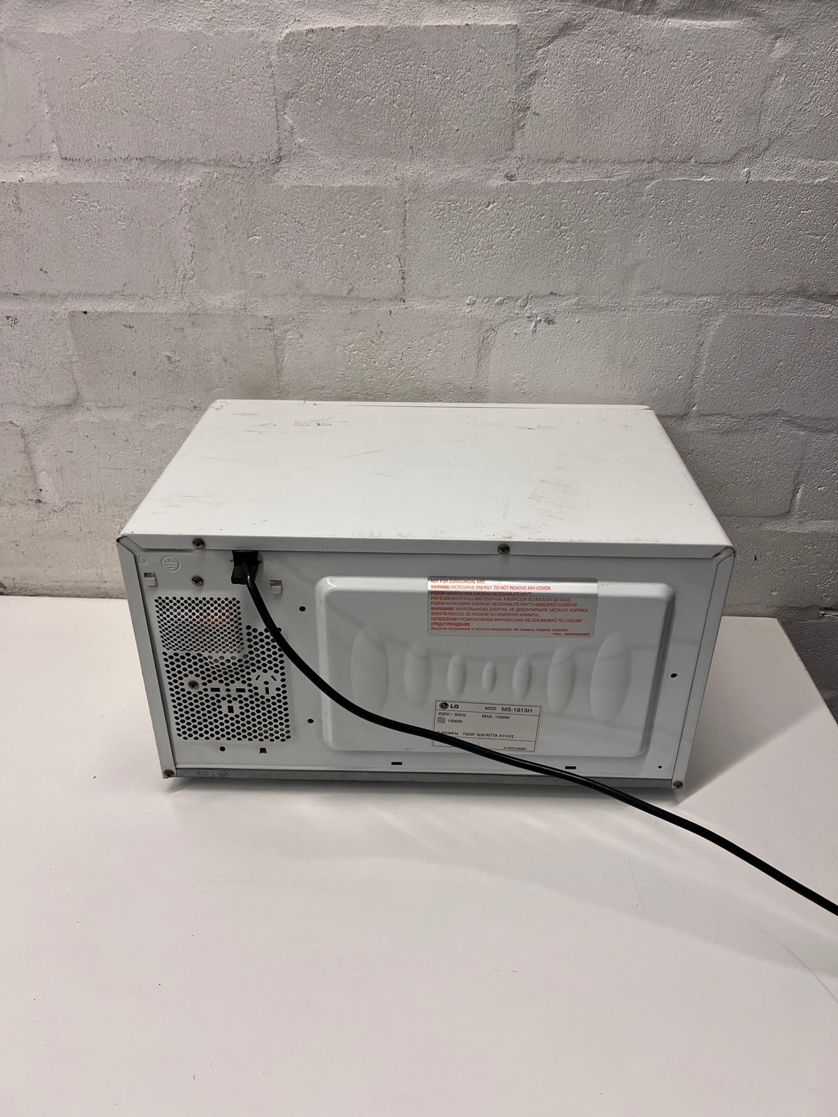 LG Intellowave Countertop Microwave in White — Burning Odour During Use and Missing Internal Plate – back view