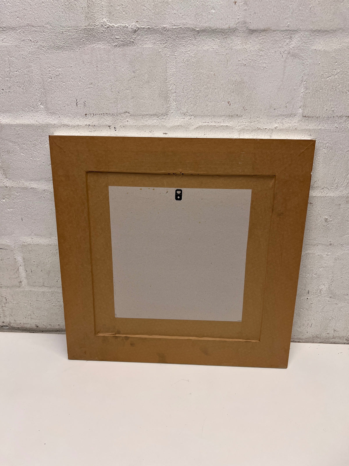 Square Coastal Print in White Washed Wooden Frame – side view