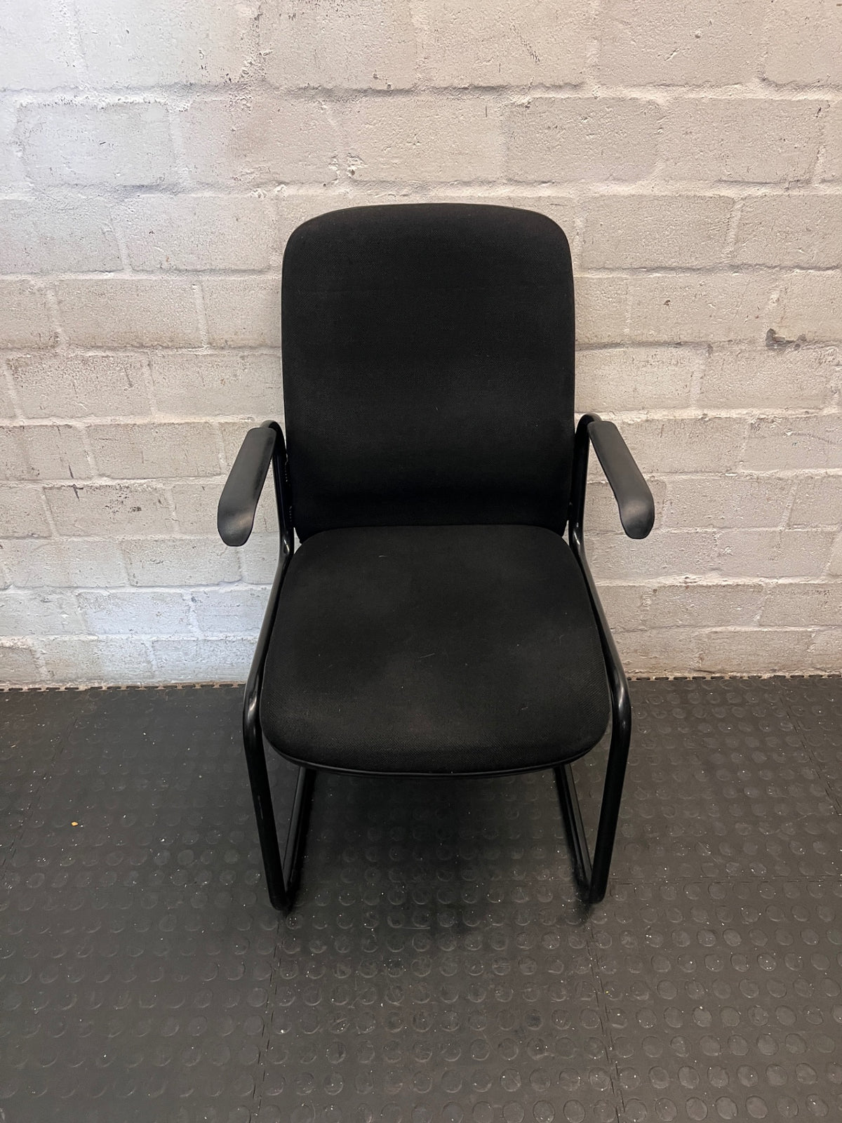 Black Upholstered Office Visitors Chair with Arms – main front view