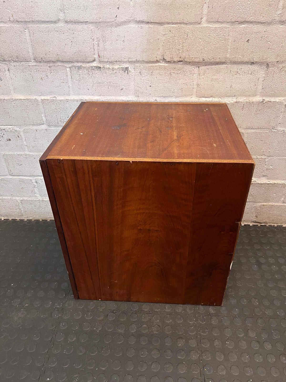 Dark Brown Wood Side Cabinet with Moulding Detail — Visible Damage to Cabinet Doors – back view