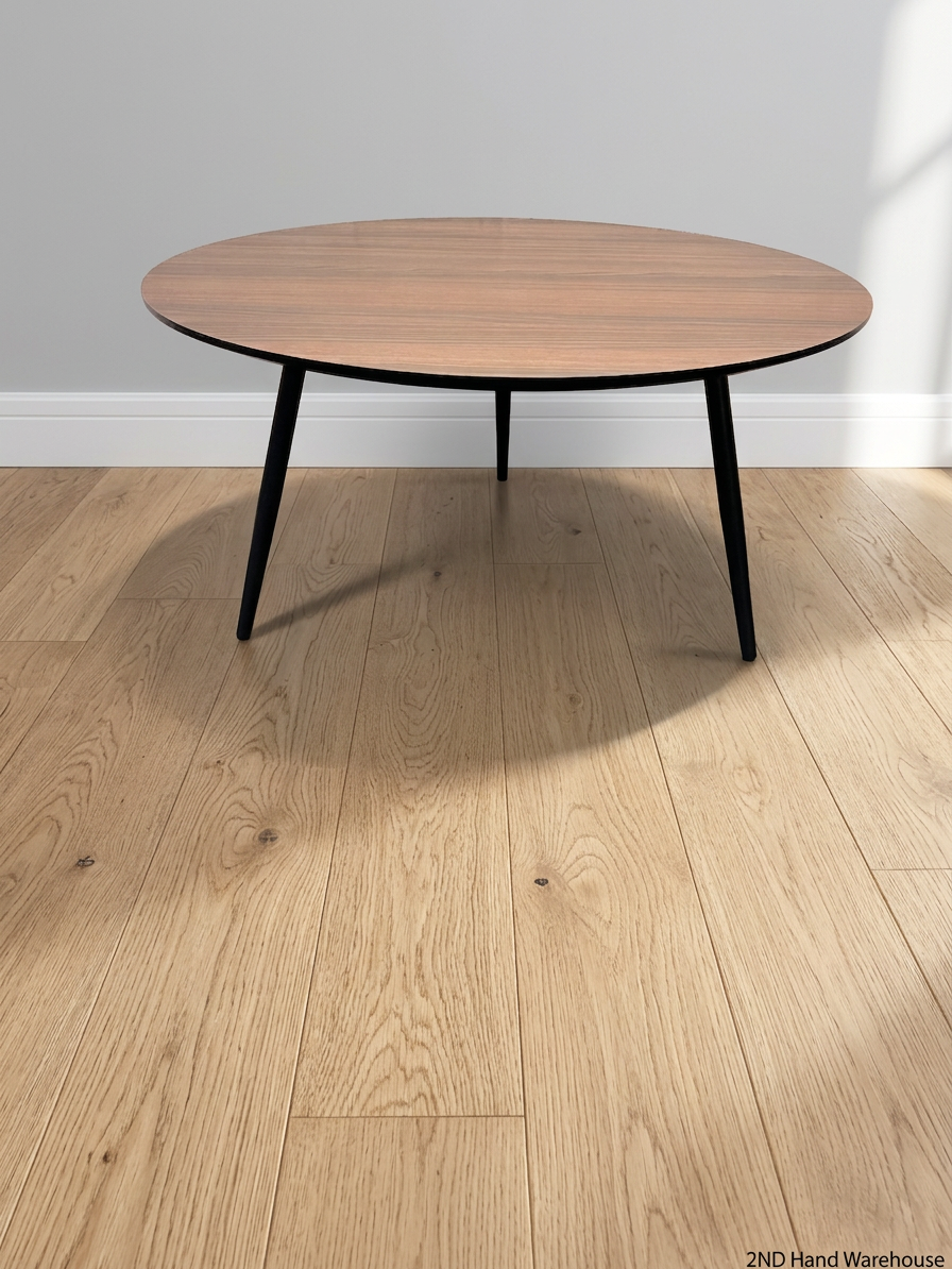 Round Wood-Grain Finish Coffee Table with Tapered Legs – styled product image