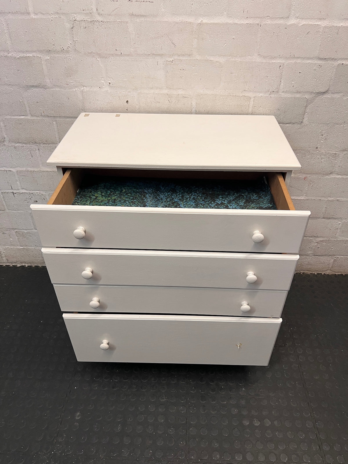 White Four-Drawer Chest of Drawers – side view