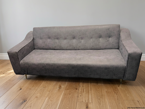 Textured Grey Sleeper Couch with Metallic Legs – styled product image
