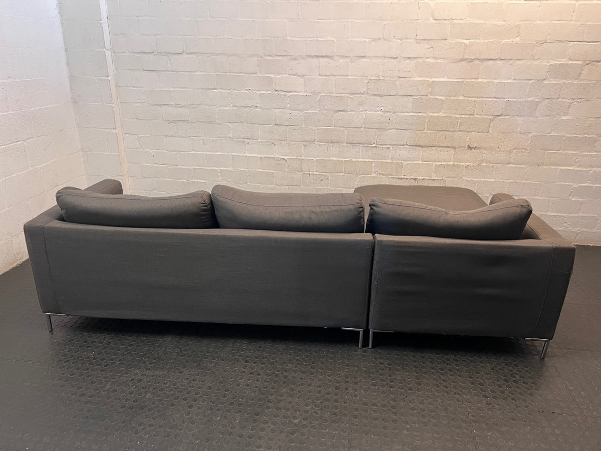 Dark Grey L-Shape Couch with Chrome Legs – back view
