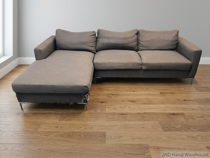 Dark Grey L-Shape Couch with Chrome Legs – styled product image