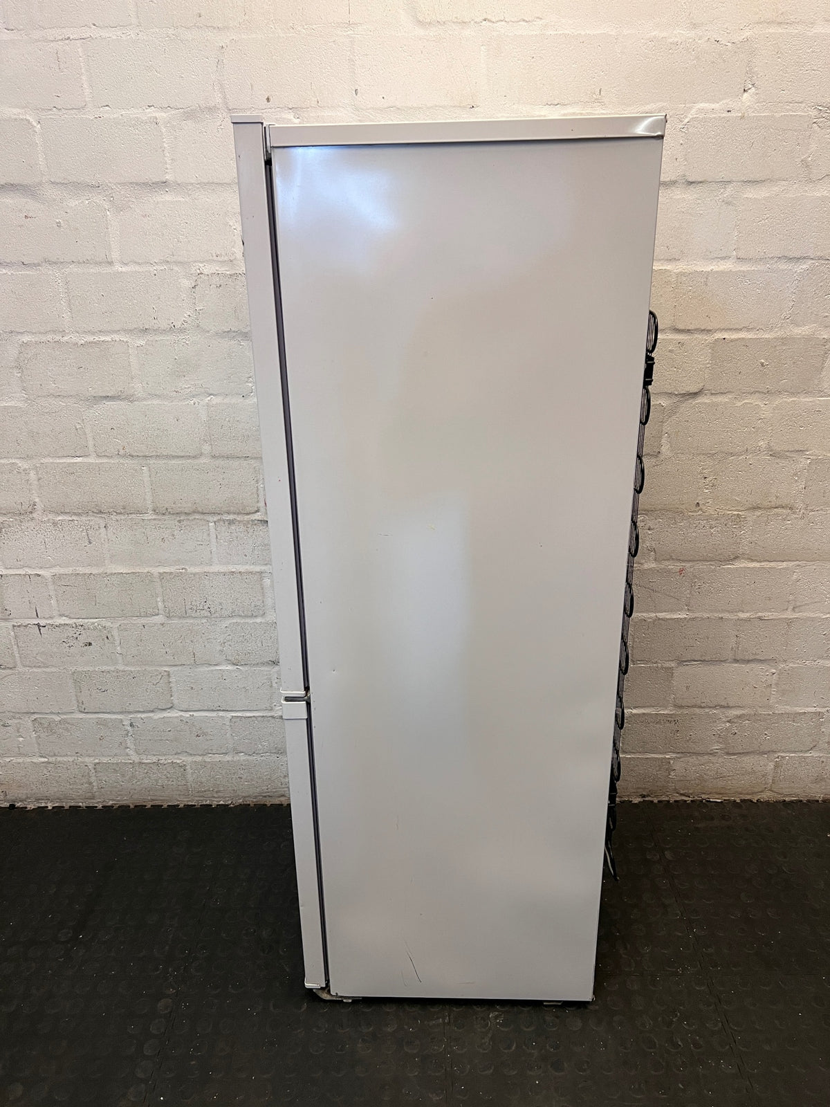Defy White Freestanding Fridge Freezer — Non-Cooling with Structural and Shelf Damage – top view