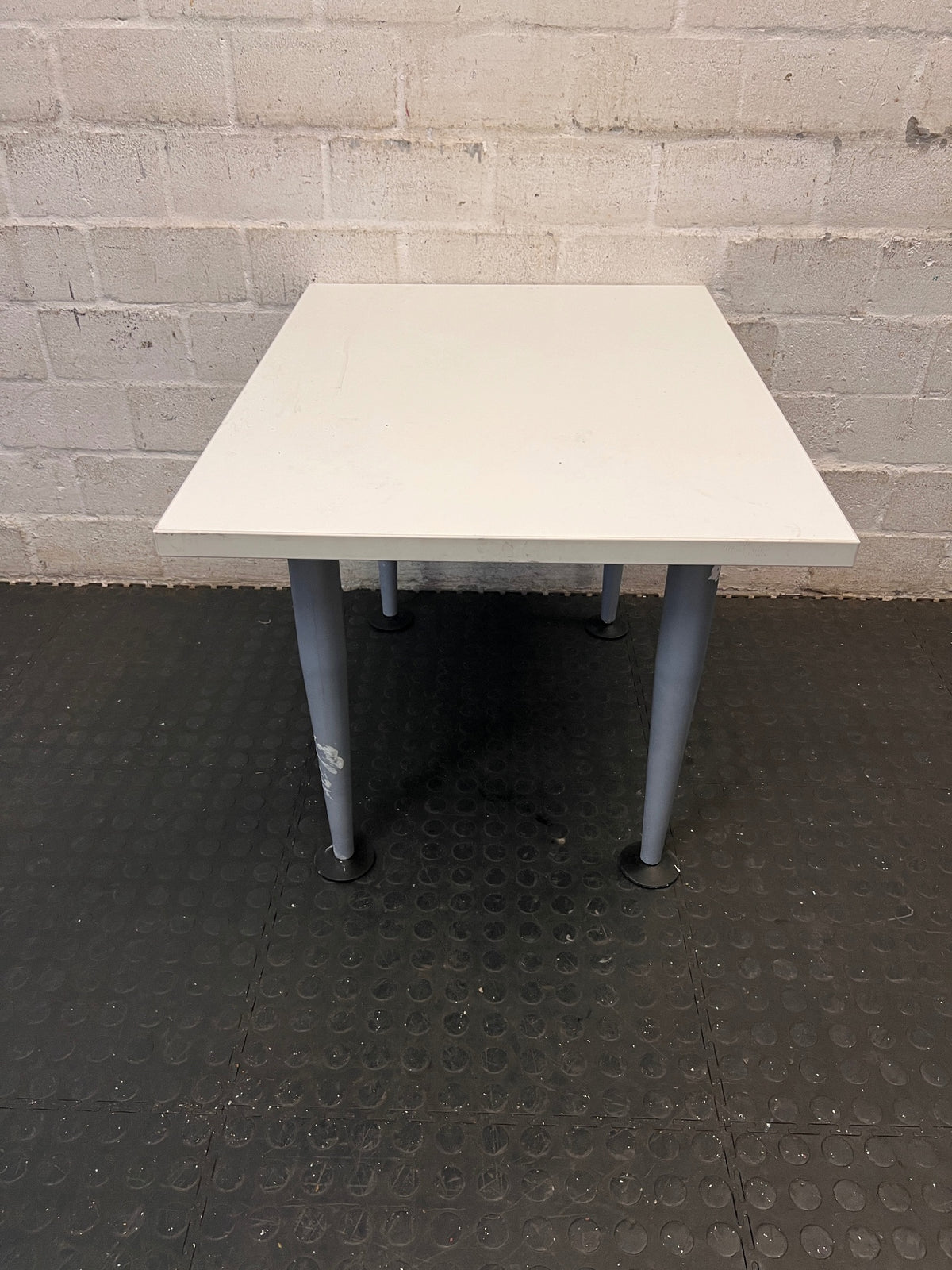 White Rectangular Coffee Table with Tapered Grey Legs – back view
