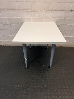 White Rectangular Coffee Table with Tapered Grey Legs – back view