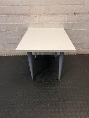 White Rectangular Coffee Table with Tapered Grey Legs – side view