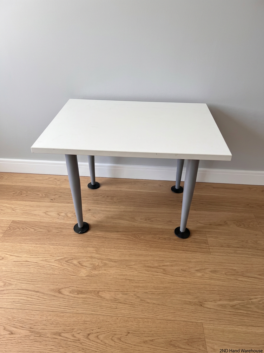 White Rectangular Coffee Table with Tapered Grey Legs – styled product image
